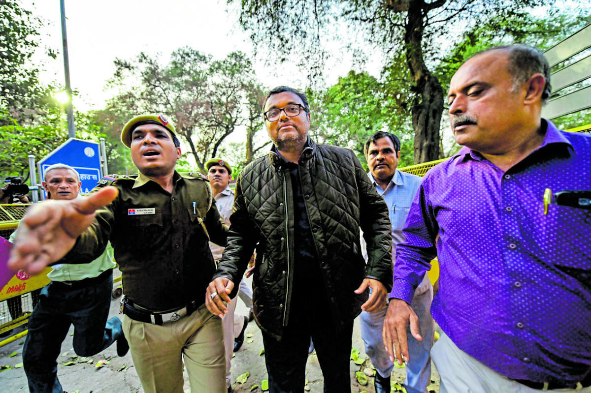 Karti Chidambaram, son of former Union minister P Chidambaram escorted by police personnel to the Patiala House court in New Delhi. PTI