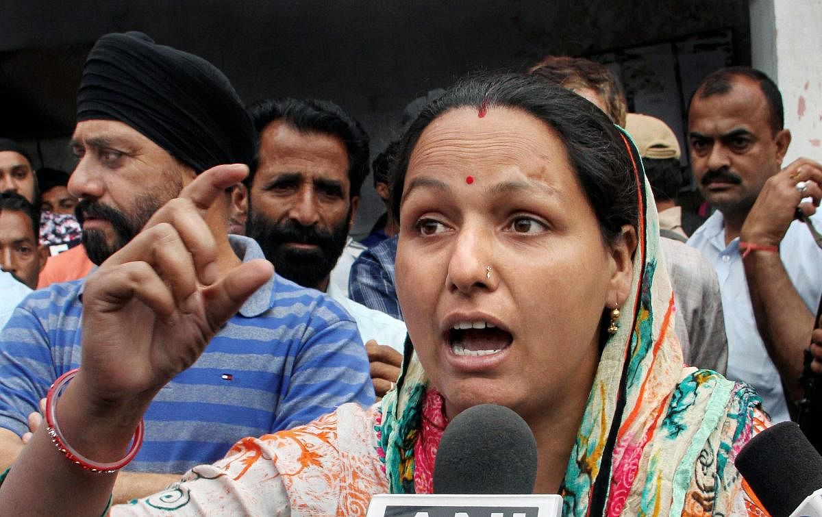 Madhu Sharma, daughter of the main accused in Kathua rape and murder case Sanji Ram, talks to the media demand to demand a CBI probe in the case, on Monday. PTI