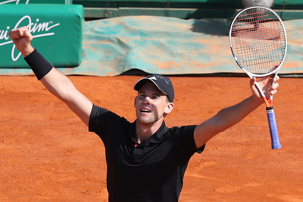 Austria's Dominic Thiem celebrates after beating Serbia's Novak Djokovic in the third round of the Monte Carlo Masters on Thursday. AFP