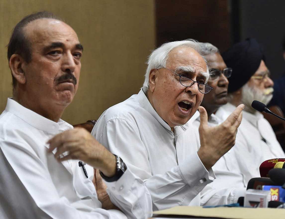 Congress leader Kapil Sibal addresses a press conference after opposition parties submitted a notice to the Vice President and Rajya Sabha Chairperson Venkaiah Naidu to initiate impeachment proceedings against Chief Justice of India Dipak Misra, in New Delhi on Friday. Congress leader Ghulam Nabi Azad, CPI leader D Raja and Rajya Sabha MP KTS Tulsi are also seen. PTI Photo