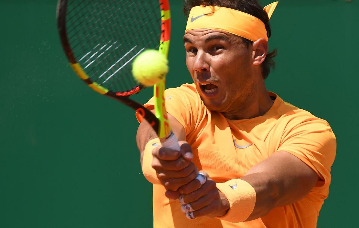 Ruthless: Spain's Rafael Nadal returns to Austria's Dominic Thiem during their singles game at the Monte-Carlo ATP Masters Series in Monaco on Friday. AFP