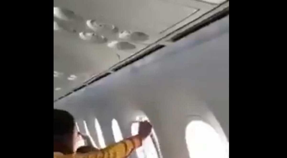 Screengrab of a video showing AI flight passengers experiencing turbulence.  