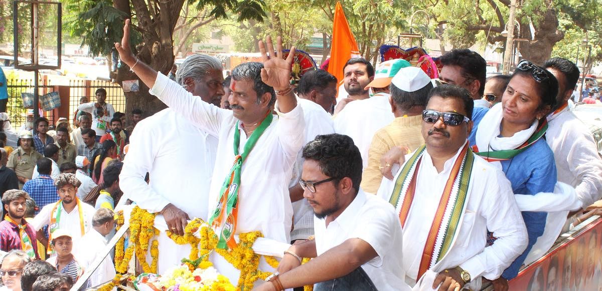 Hubballi-Dharwad Central constituency Congress candidate Mahesh Nalwad waves at his supporters during the roadshow held before he filed the nomination, in Hubballi on Tuesday.
