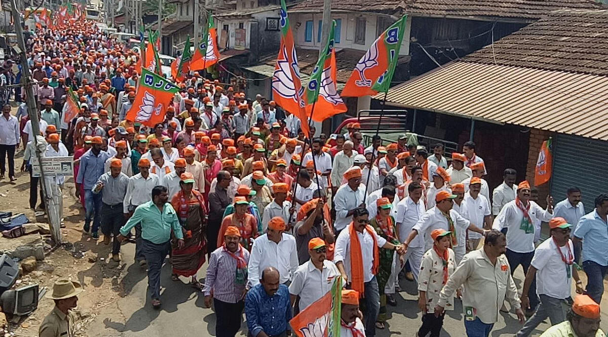 BJP workers took out a procession before candidate K G Bopaiah filed his nomination papers in Virajpet on Tuesday.
