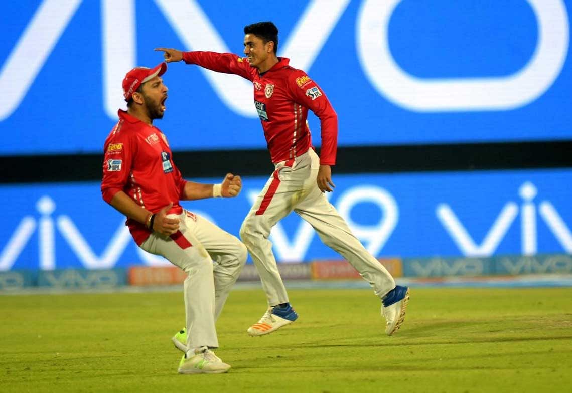 Kings XI Punjab cricketers cerebrate their victory against Delhi Daredevils during the IPL T20match at Ferozshah Kotla in New Delhi on Monday. PTI Photo