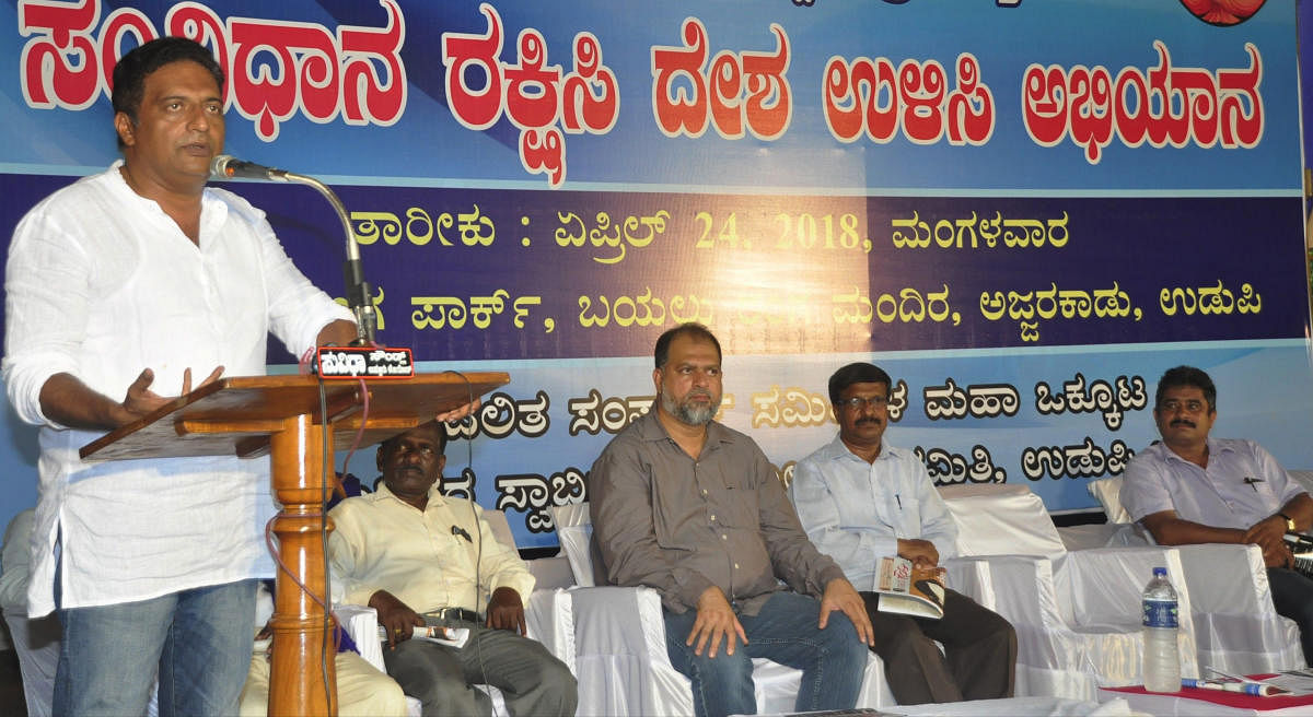 Actor Prakash Rai speaks at save constitution and save country campaign held as a part of 127th birth anniversary of Dr B R Ambedkar, in Udupi on Tuesday.