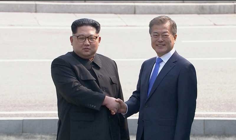 North Korean leader Kim Jong Un shakes hands with South Korean President Moon Jae-in as both of them arrive for the inter-Korean summit at the truce village of Panmunjom, in this still frame taken from video, South Korea April 27, 2018.