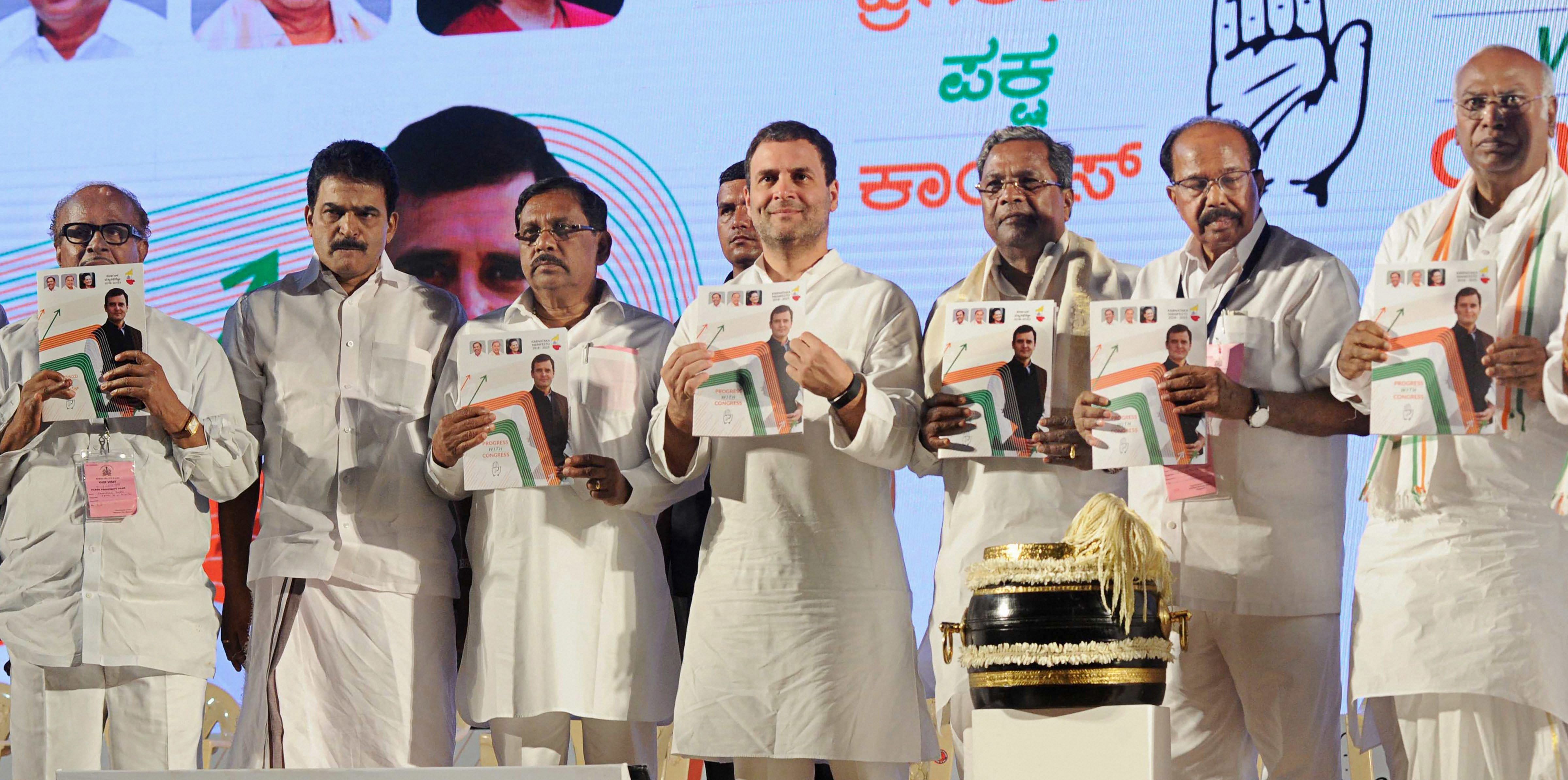 Congress president Rahul Gandhi releases the party manifesto for the 2018 Karnataka Assembly Elections in Mangaluru on Friday. PTI