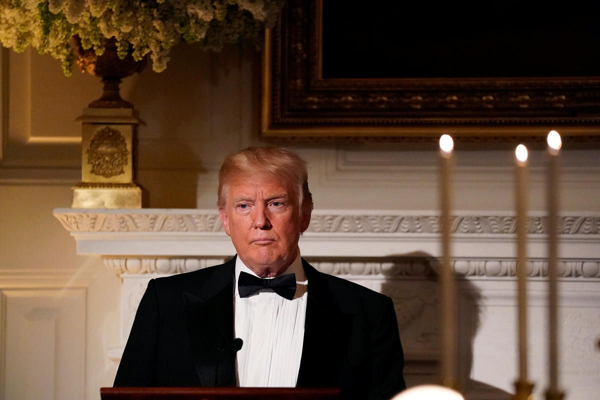 U.S. President Donald Trump toasts French President Emmanuel Macron (not pictured) during a State Dinner at the White House in Washington, U.S. April 24, 2018.