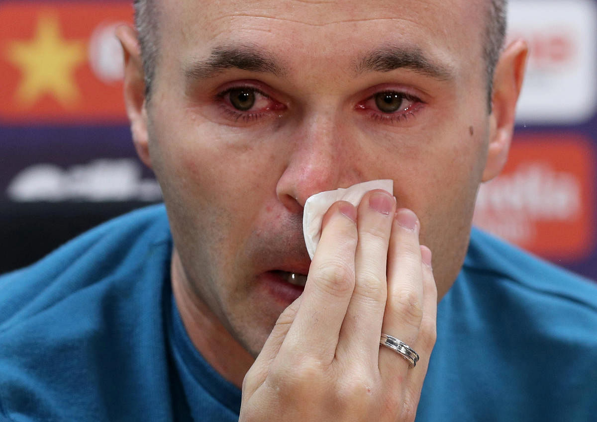 Andres Iniesta breaks down during a press conference on Friday where he announced he'll be leaving Barcelona at the end of the season. REUTERS