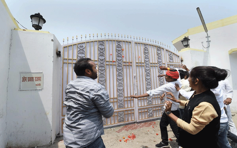 Irate Samajwadi Party (SP) workers on Saturday threw tomatoes at Rajbhar's official residence in the state capital and also damaged his nameplate in protest against the remarks. (PTI photo)