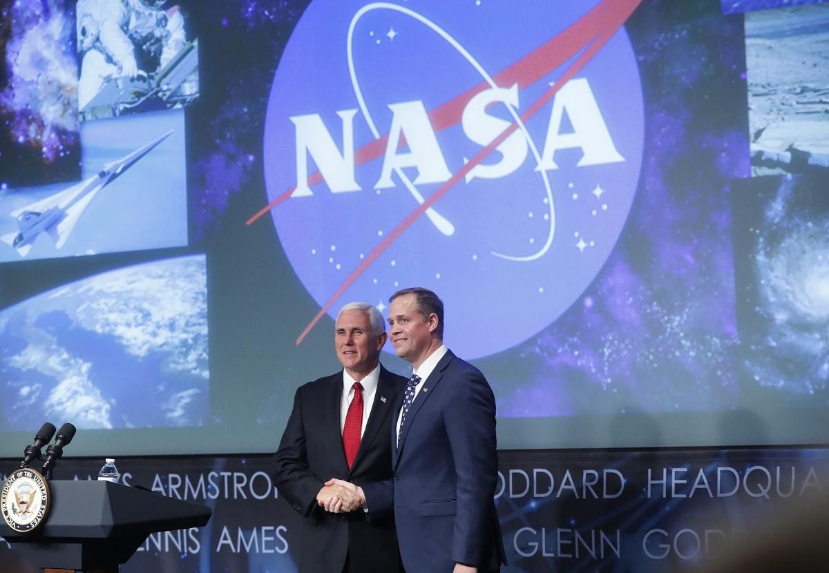 Vice President Mike Pence shakes hands with the new NASA administrator Jim Bridenstine at NASA Headquarters in Washington. AP/PTI Photo
