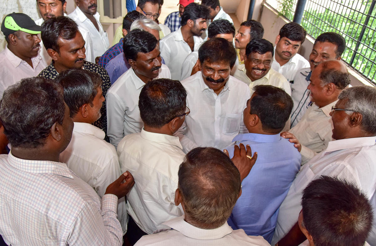 Nelamangala constituency Congress Candidate R Narayana Swamy discursion with his supporters, at his residence, Nelamangala, Rural Bengaluru on Thursday. Photo/ B H Shivakumar ,