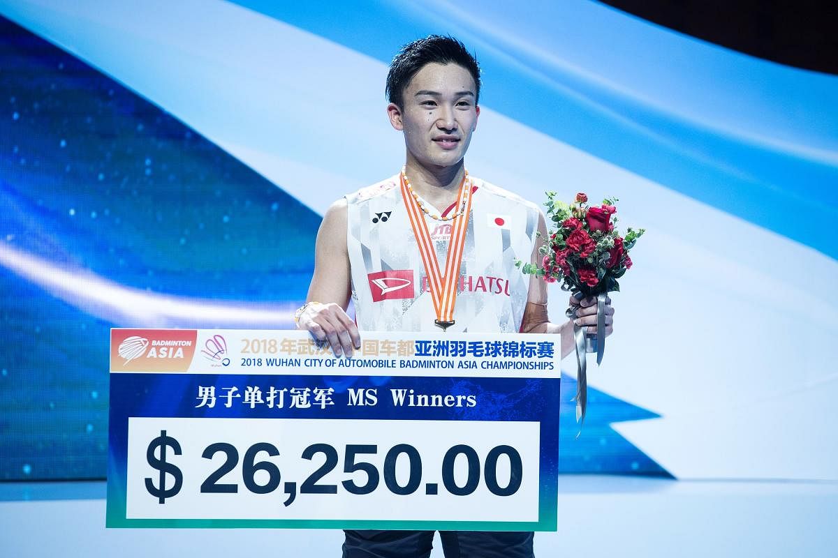 Japan's Kento Momota is all smiles after beating Chen Long to clinch the title