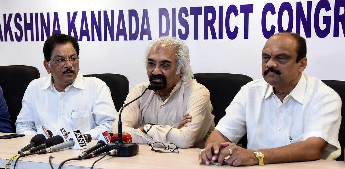 Congress leader and National Knowledge Commission former chairman Sam Pitroda (centre) speaks during a press conference at the District Congress Committee office in Mangaluru on Sunday.