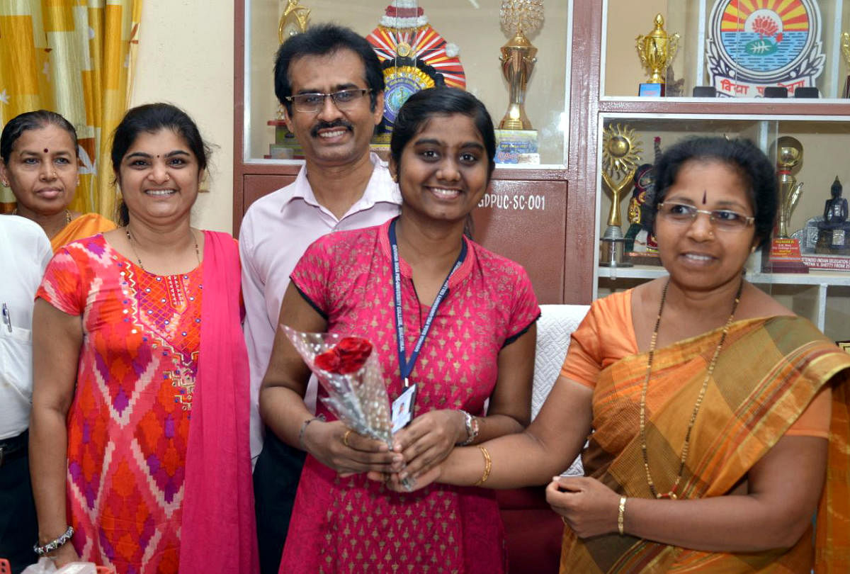 Ankitha being wished at Govinda Dasa College, Surathkal, for being the second topper in Science in the state.