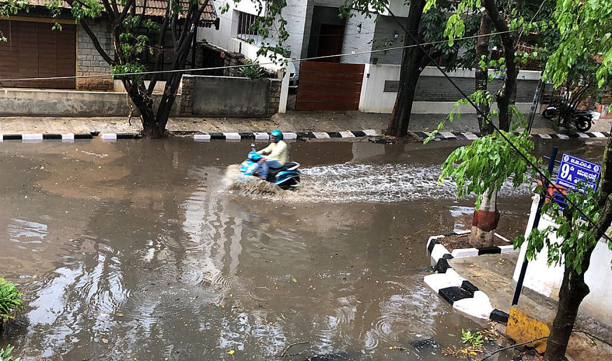 Rain water logged on Koramangala 4th block 9th a main in Bengaluru on Monday. .