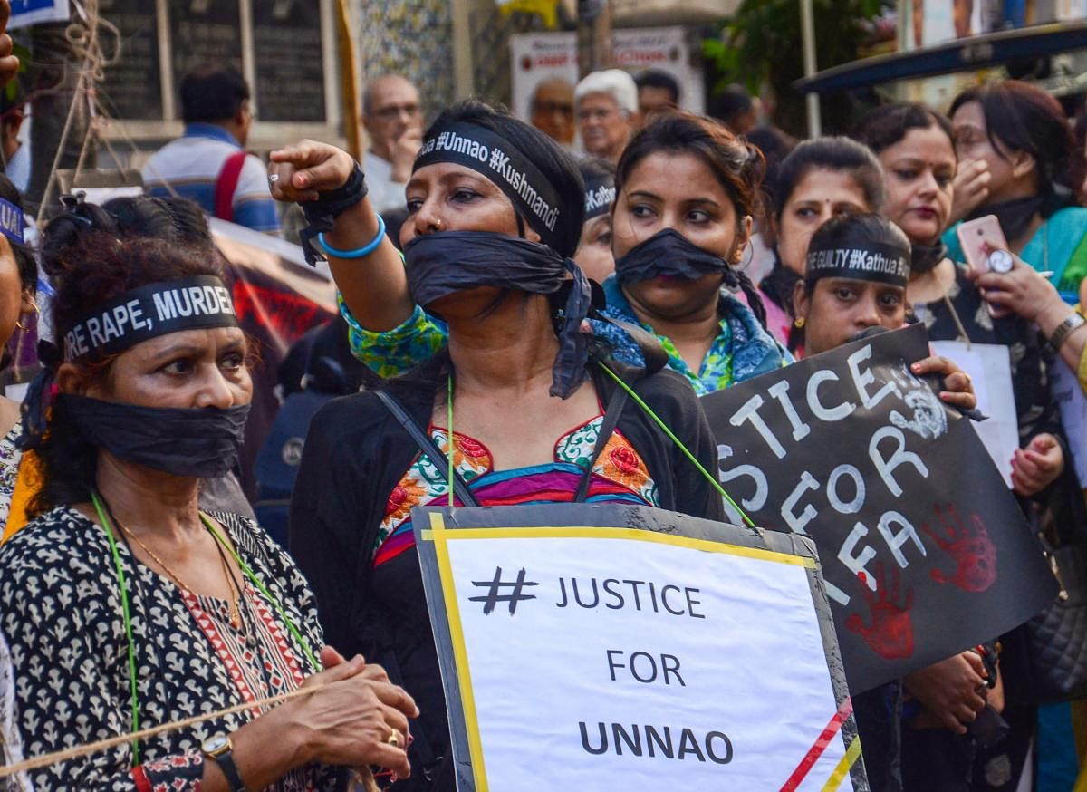 Girl students and women take part in a protest demonstration seeking justice for the victims of Kathua and Unnao rape cases, in Kolkata on Wednesday. PTI Photo