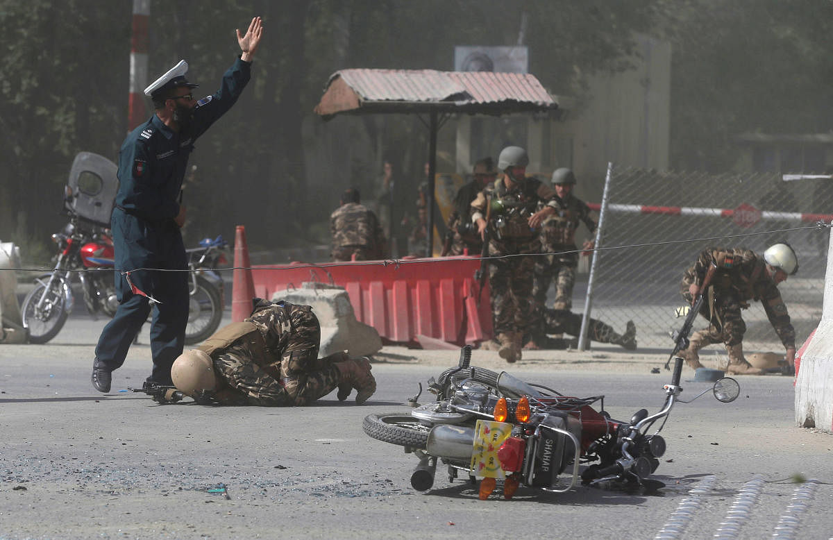Afghan security forces are seen at the site of a second blast in Kabul, Afghanistan April 30, 2018. REUTERS