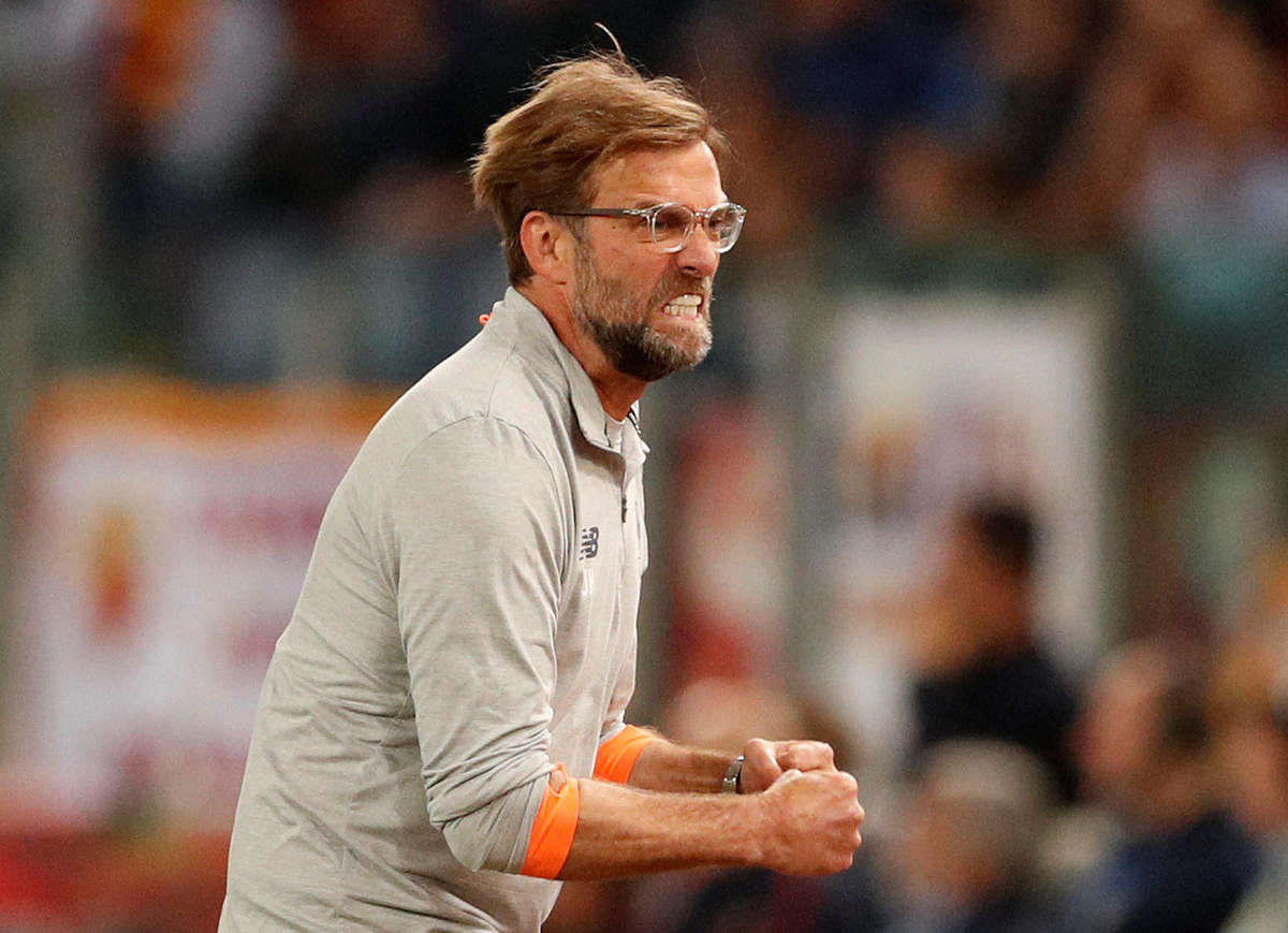 Liverpool manager Juergen Klopp celebrates after Sadio Mane scores their first goal against AS Roma in their Champions League second leg semifinal. Reuters 