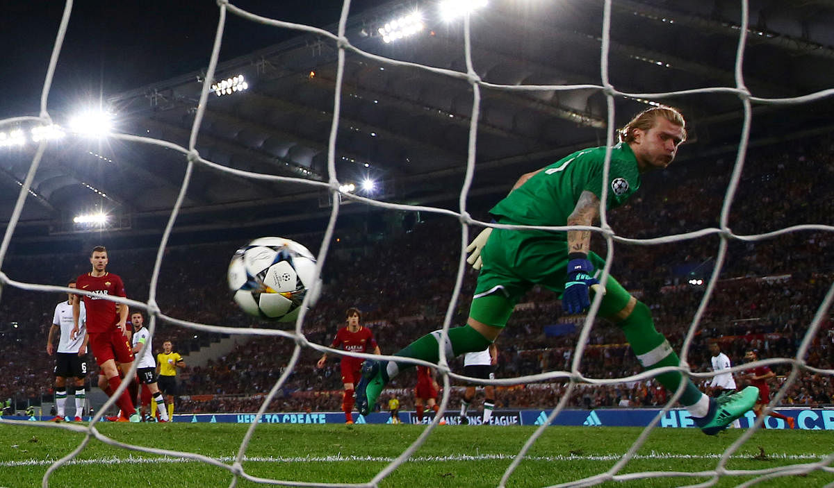 Roma's Radja Nainggolan scores their third goal as Liverpool's Loris Karius watches the ball go in the net. REUTERS Photo