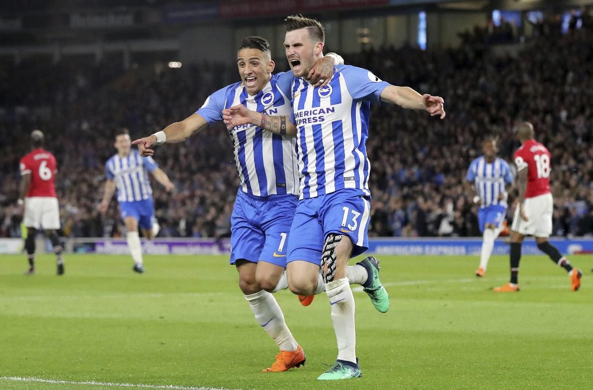 On seventh heaven: Brighton &amp; Hove Albion's Pascal Gross (right) celebrates with team-mate Anthony Knockaert after scoring against Manchester United on Saturday. AP-PTI