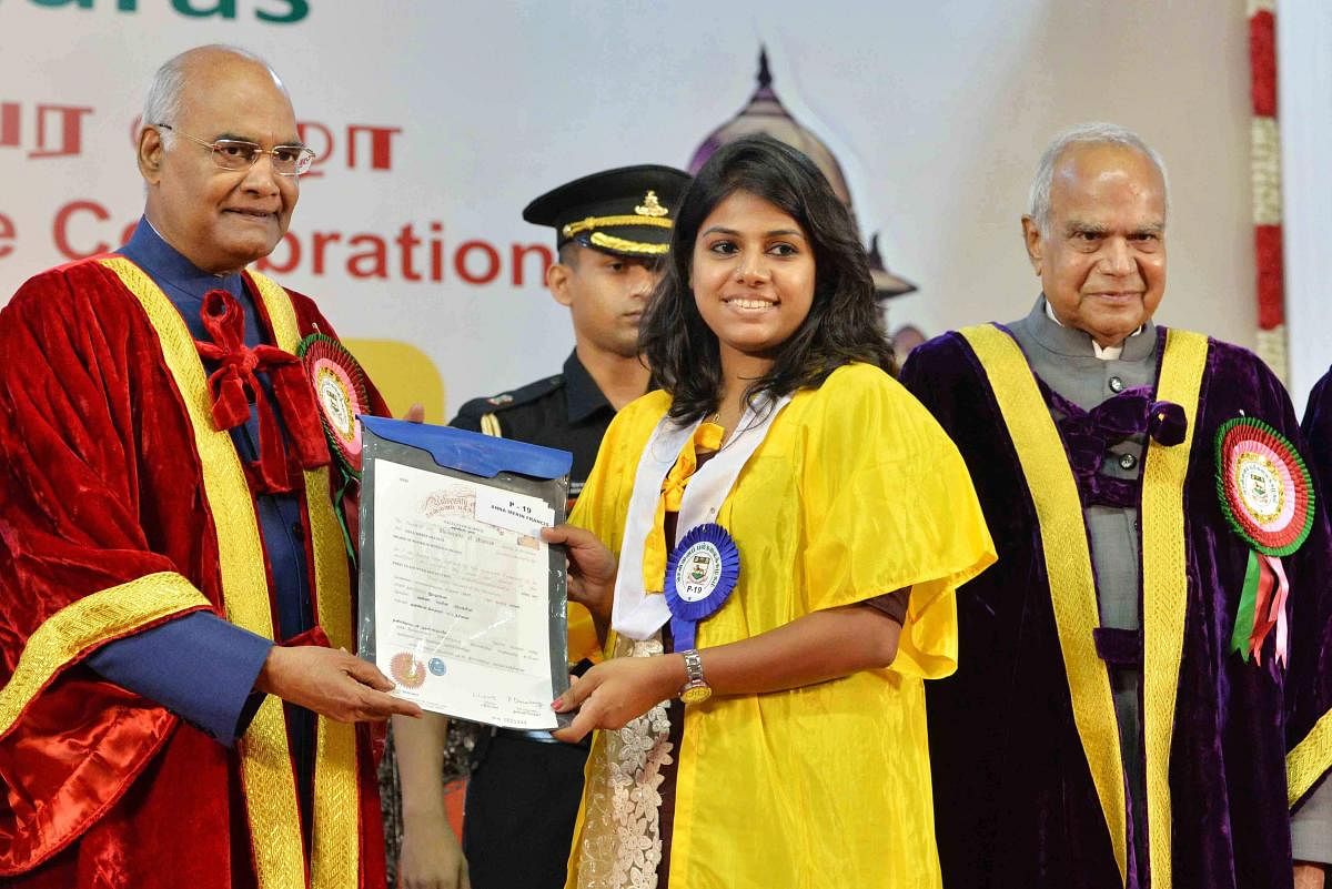 President Ram Nath Kovind presents a certificate during the post-centenary Diamond Jubilee convocation of University of Madras in Chennai on Saturday. PTI Photo