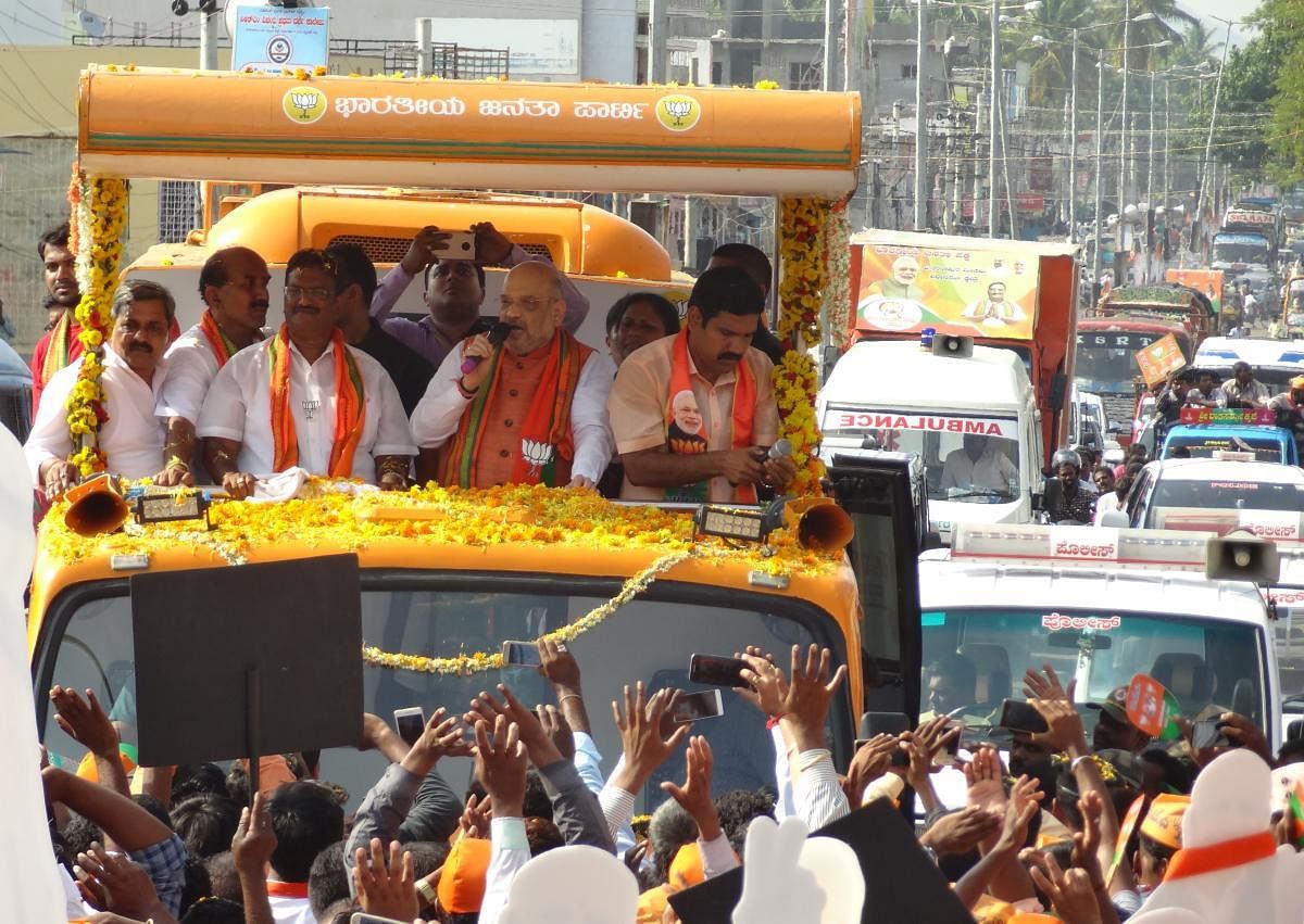 BJP president Amit Shah takes out road show in T Narasipur town, Mysuru, on Saturday.