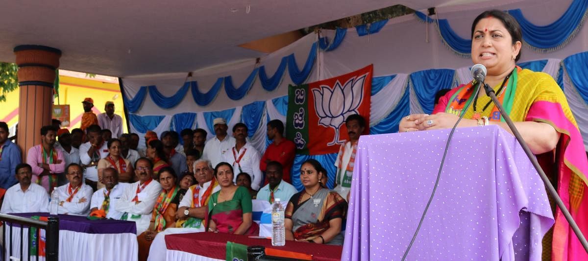 Union Minister for Textiles and Information and Broadcasting Smriti Irani speaks during the BJP campaign in Somvarpet on Monday.