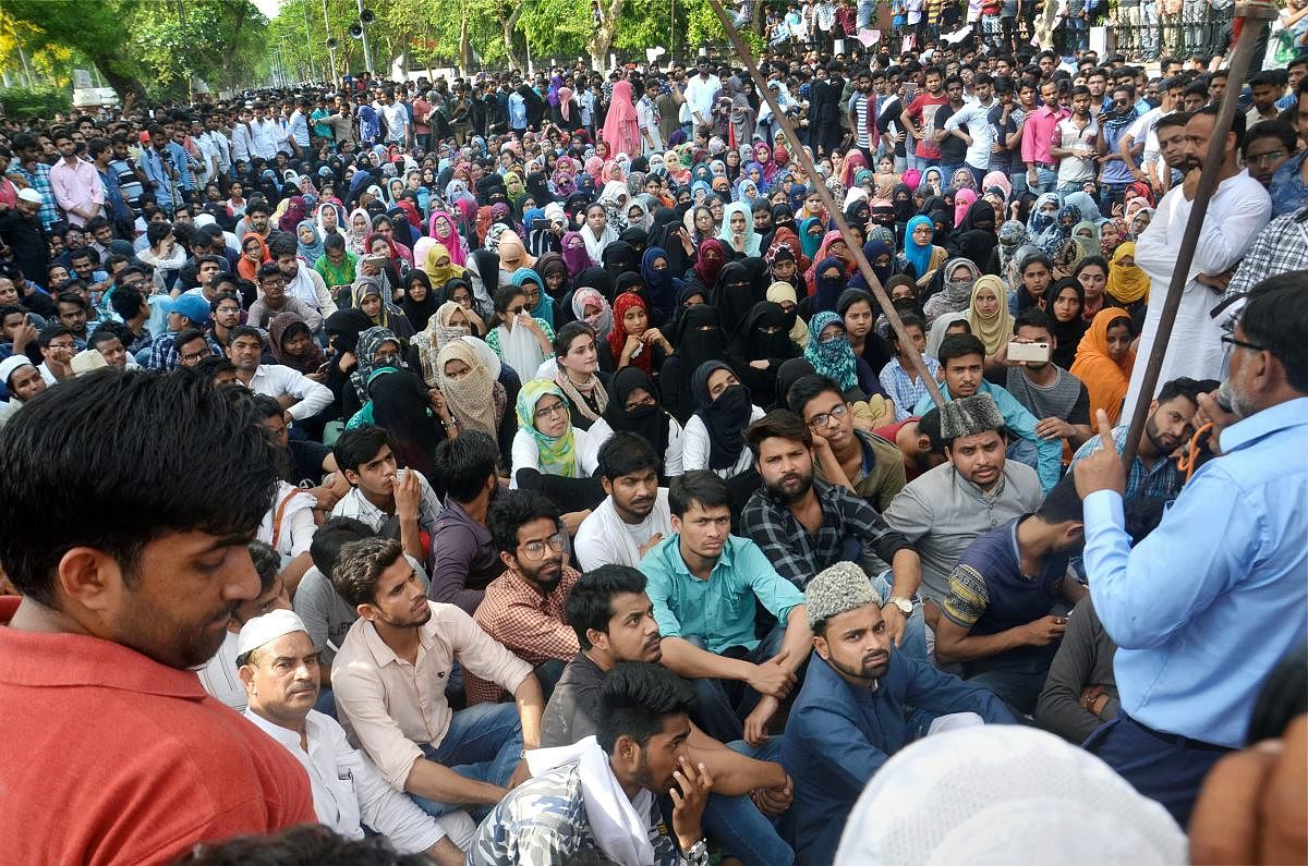 Aligarh Muslim University students stage a protest in campus over Jinnah portrait issue. PTI