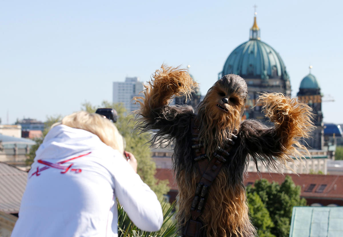 A person dressed up as Chewbacca character poses during a photocall to promote the new Star Wars Movie "Solo: A Star Wars Story" in Berlin. REUTERS Photo