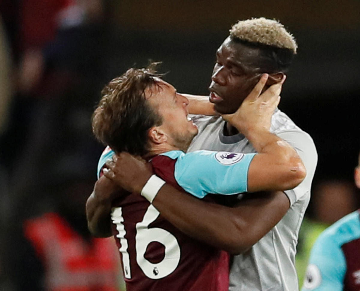 TEMPERS FLARE West Ham United's Mark Noble (left) clashes with United's Paul Pogba on Thursday. REUTERS