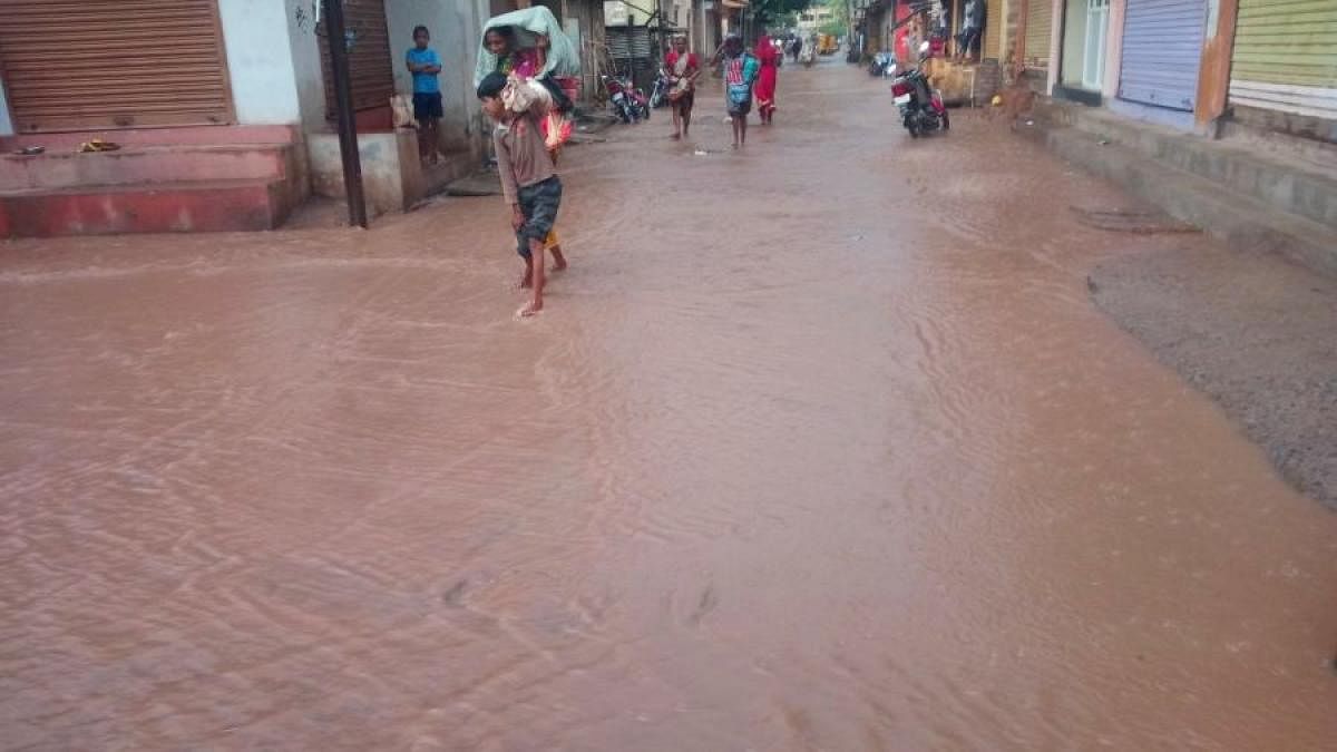 Rainwater overflows on a street in Kamatagi villageof Bagalkot district on Friday.