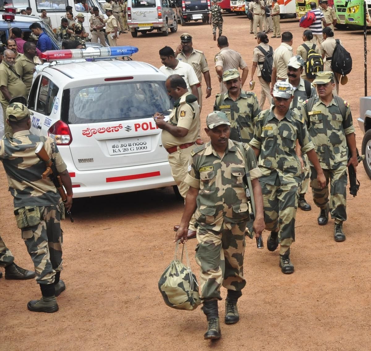 Paramilitary personnel leaving for their assigned booths in Udupi on Friday.