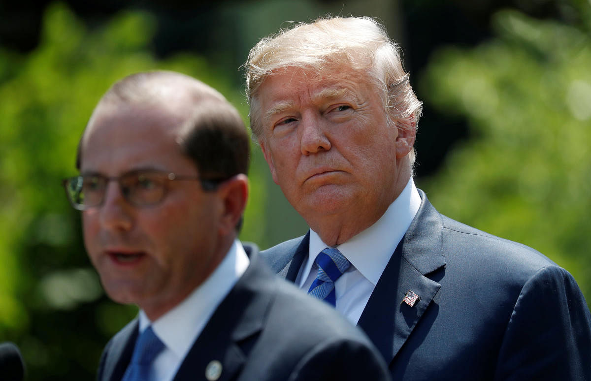 US President Donald Trump listens to Health and Human Services Secretary Alex Azar speak about lowering drug prices from the Rose Garden at the White House in Washington. REUTERS Photo