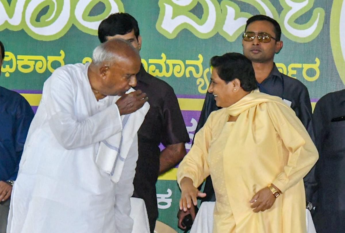 BSP chief Mayawati interacts with former Prime Minister HD Deve Gowda during a campaign for Karnataka Assembly Elections in Mysuru. PTI file photo