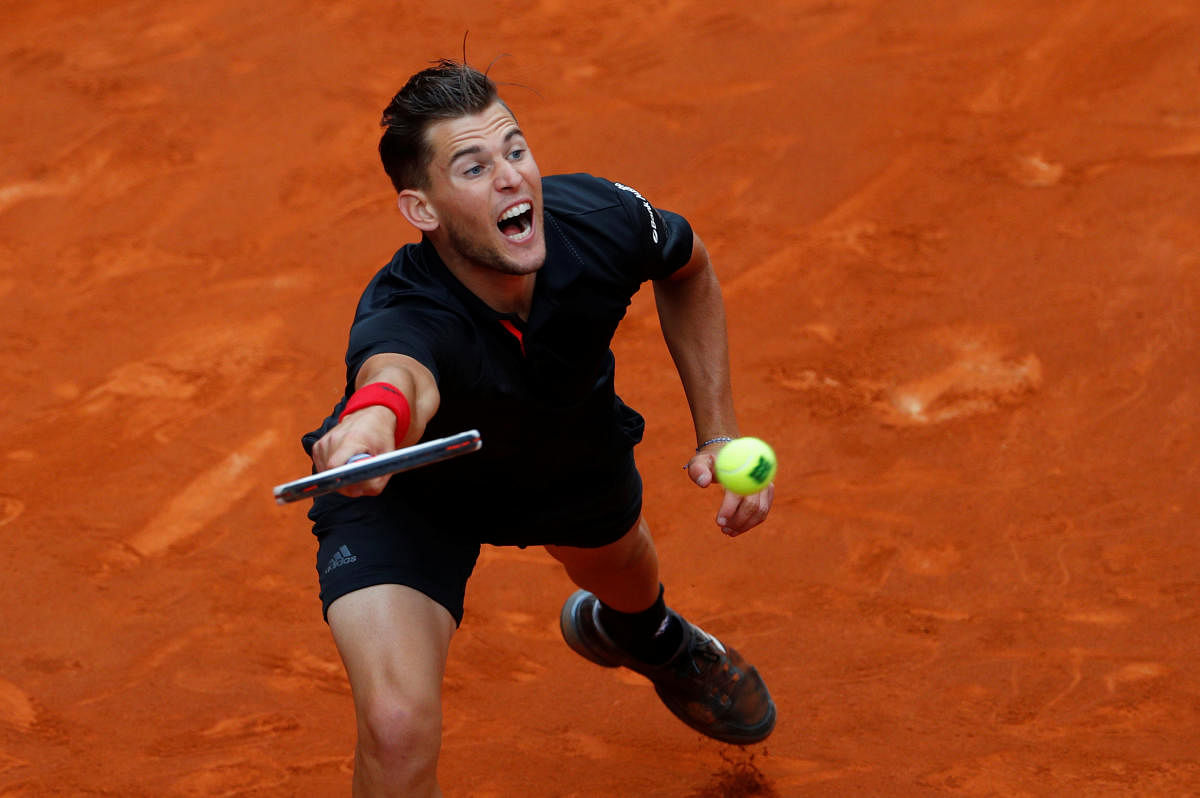 On song Austria’s Dominic Thiem returns to Kevin Anderson of South Africa during their semifinal clash in Madrid on Saturday. Reuters
