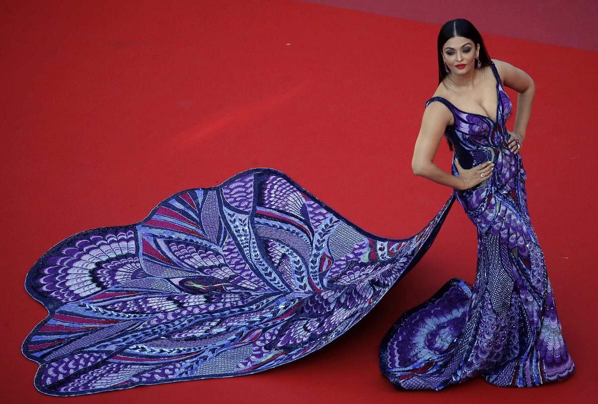 The outfit, designed by Dubai-based couturer Michael Cinco, was patterned with Swarovski crystals and French palettes. Ultra-violet, midnight blue, and red thread works added extra details to the gown.
