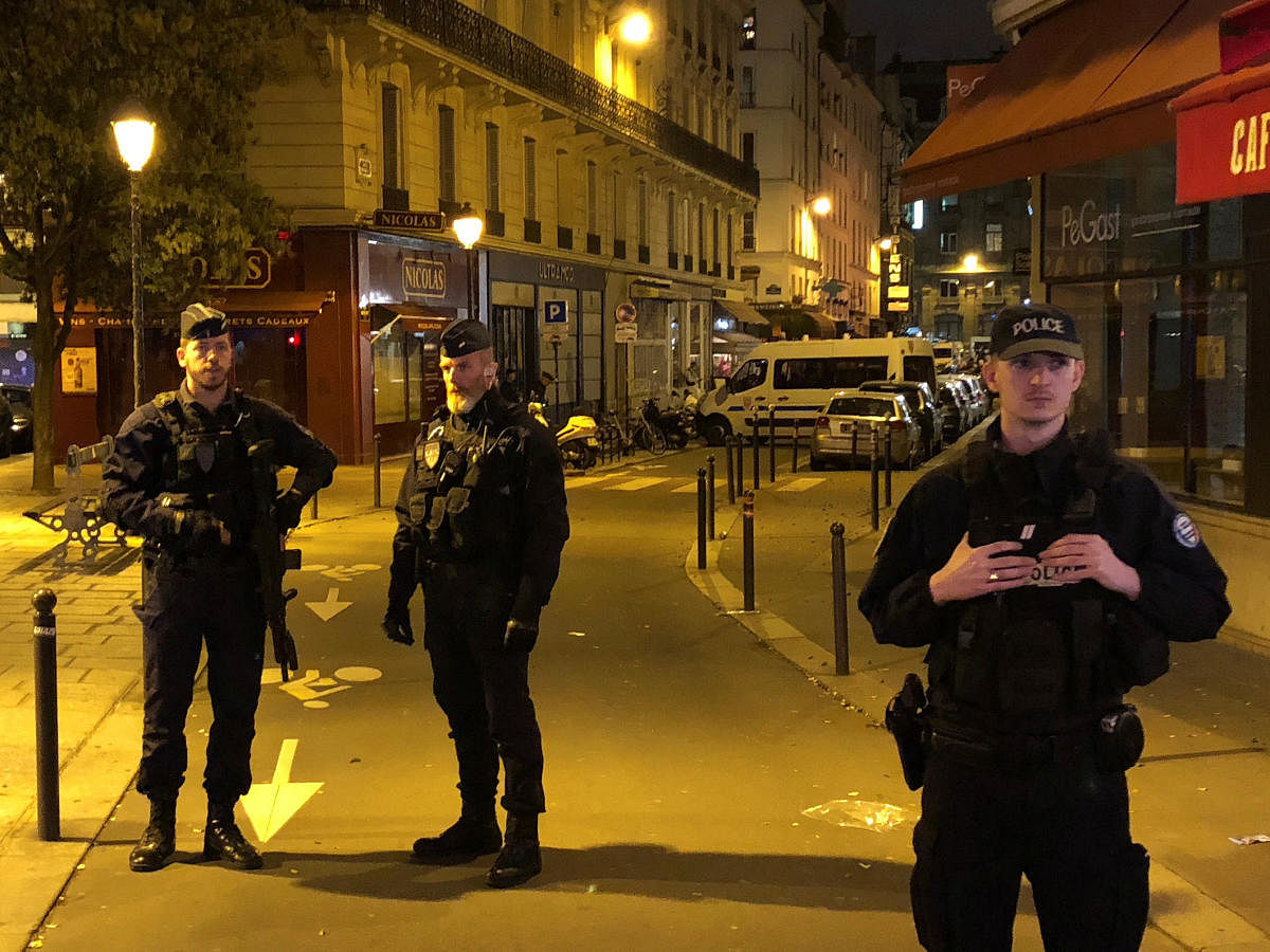 French police secure a street after a man killed a passer-by in a knife attack in the heart of Paris and injured four others before being shot dead by police, according to French authorities in Paris, France, May 12, 2018. REUTERS