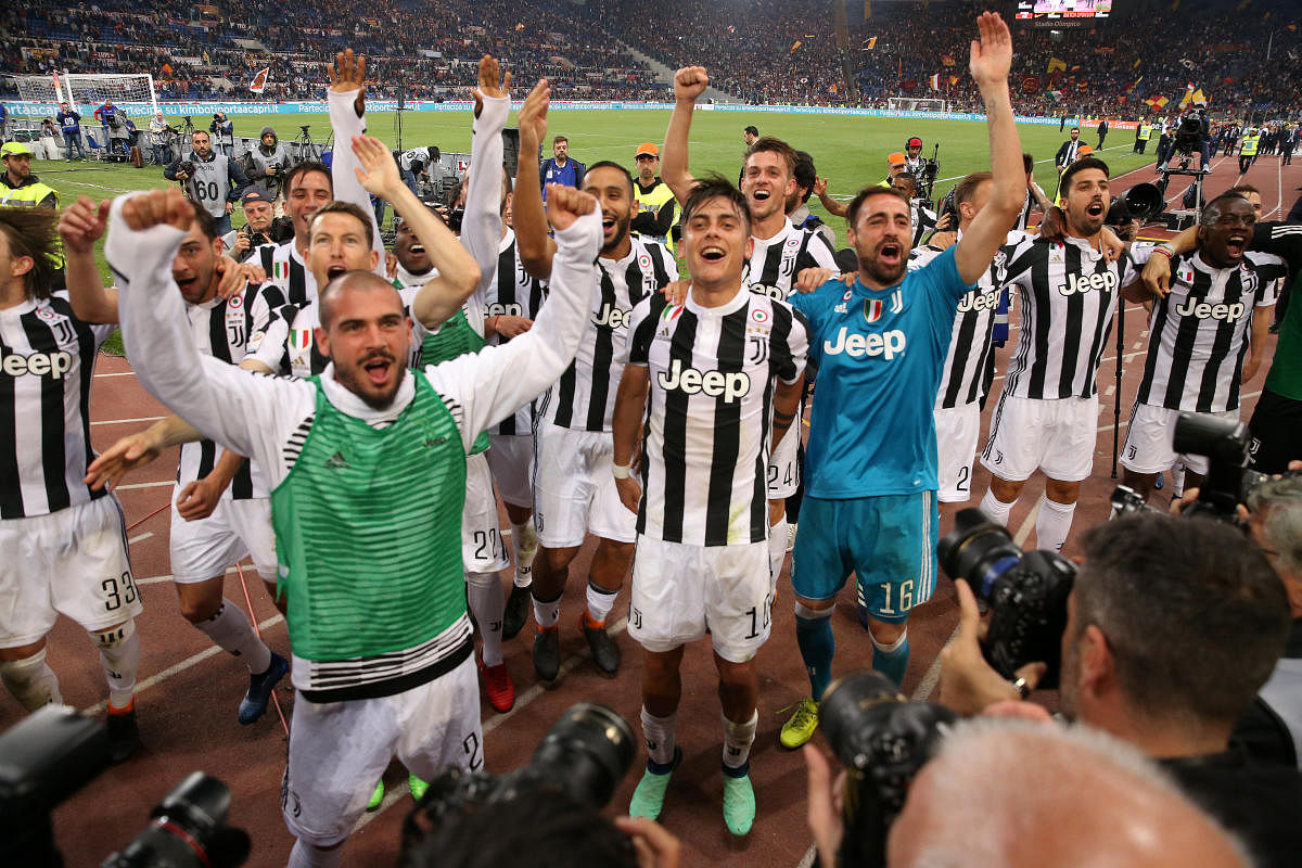  Juventus players celebrate after pocketing their seventh straight Serie A title on Sunday. REUTERS 
