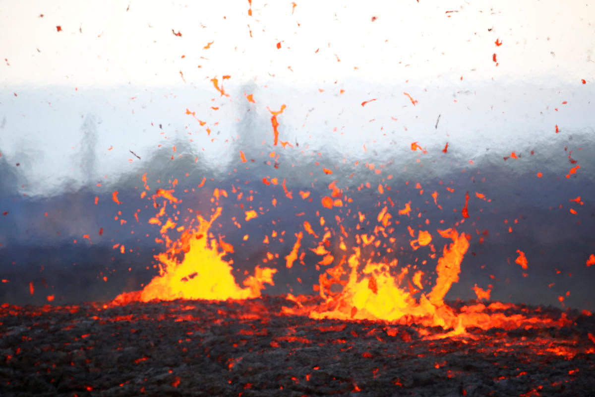 Lava erupts from a fissure on the outskirts of Pahoa during ongoing eruptions of the Kilauea Volcano in Hawaii, U.S., May 14, 2018. Reuters