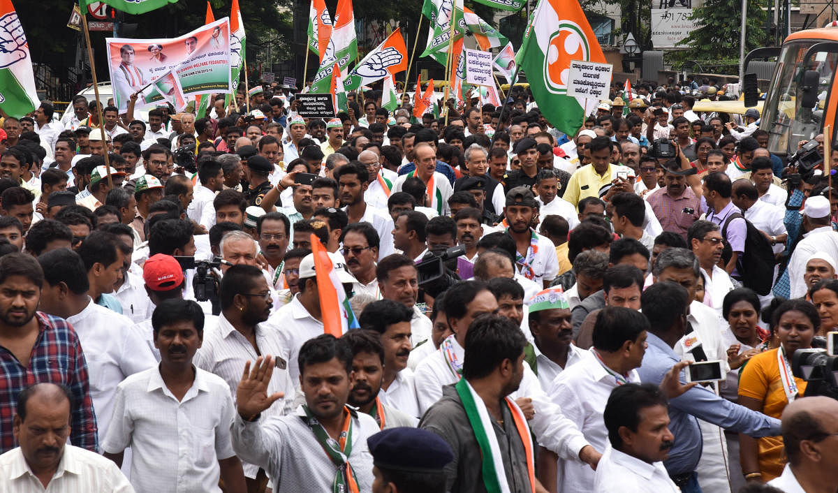 The march was organised to protest against Governor Vajubhai Vala's decision of inviting the BJP to form the government, despite lacking a majority. DH Photo