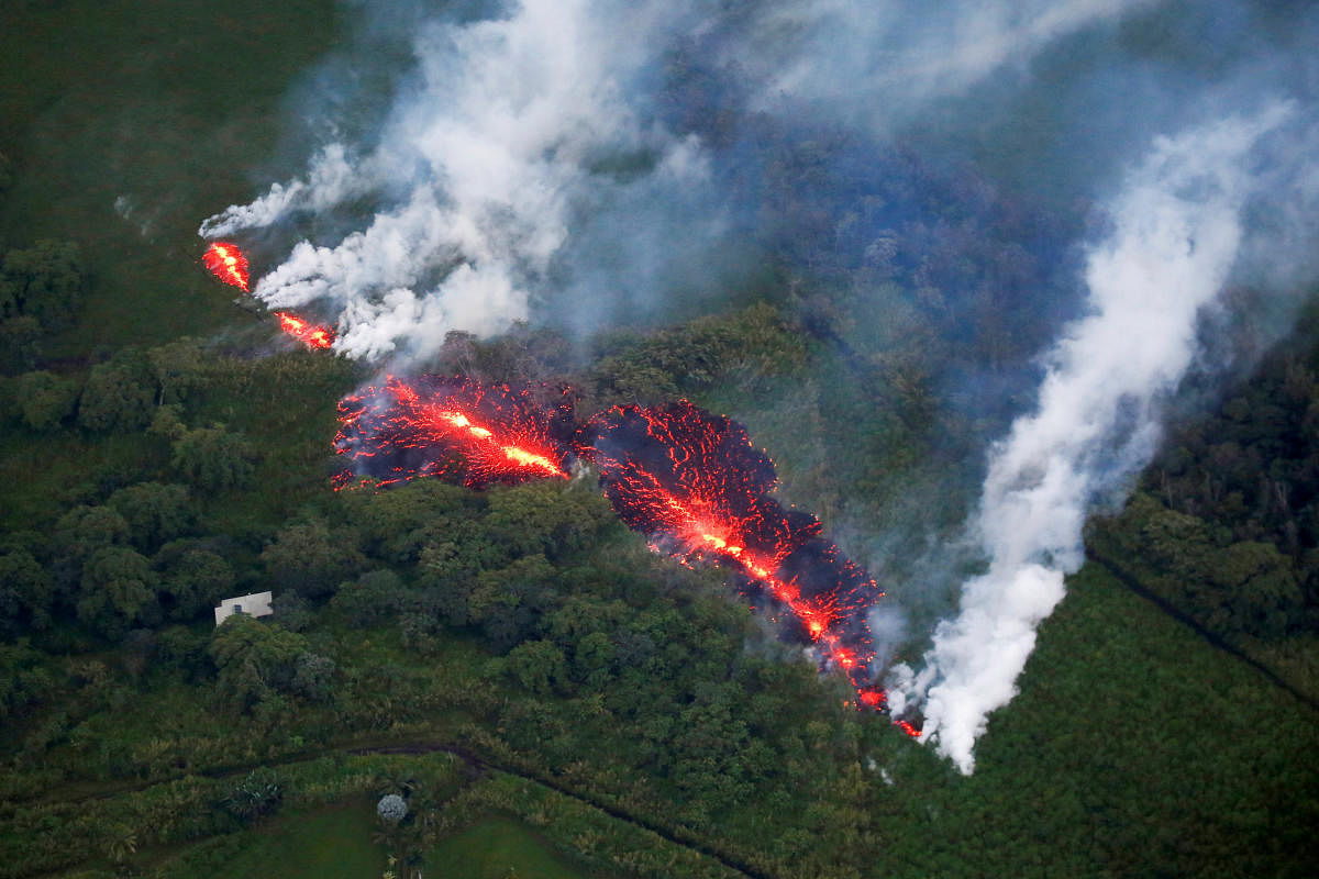Lava erupts from a fissure east of the Leilani Estates subdivision during ongoing eruptions of the Kilauea Volcano in Hawaii, U.S., May 13, 2018