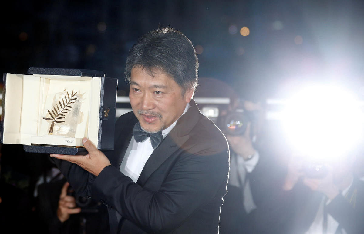 Director Hirokazu Kore-eda, Palme d'Or award winner for his film "Shoplifters" (Manbiki kazoku), poses.