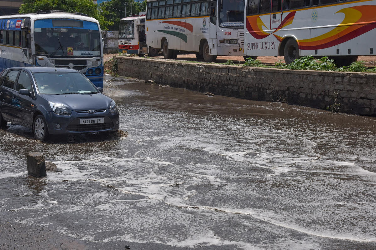 A waterlogged road in Shantinagar on Sunday. DH PHOTO/S K Dinesh
