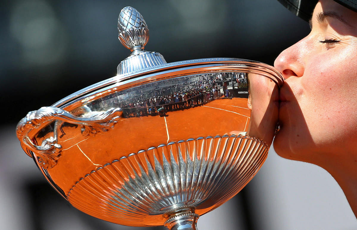 Ukraine's Elina Svitolina kisses the trophy as she celebrates winning the final of the Italian Open against Romania's Simona Halep on Sunday. Reuters