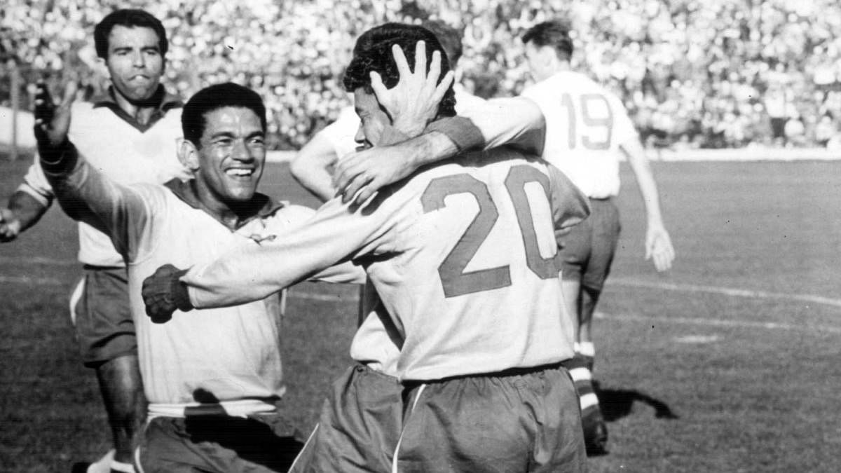 Garrincha (left) celebrates with team-mates after Brazil's third goal in the 1962 World Cup final. FIFA