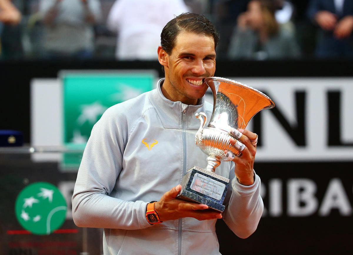 Spain's Rafael Nadal celebrates with the trophy after winning the Italian Open final against Germany's Alexander Zverev. Reuters