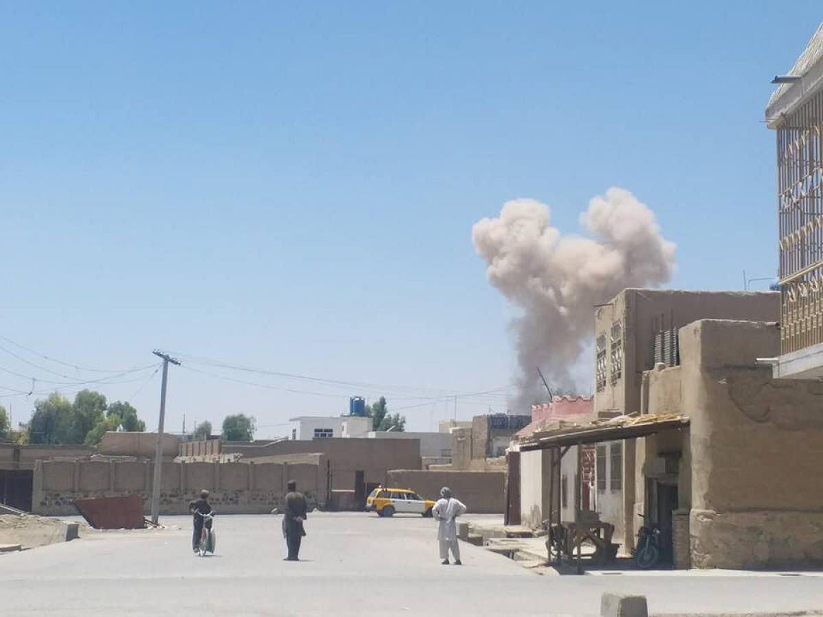 A cloud of smoke is seen after an explosion in Kandahar, Afghanistan May 22, 2018 in this picture obtained from social media. AZEEM ZMARIAL/via REUTERS