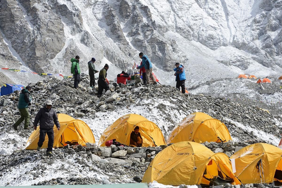 Sherpas prepare to pay respects to Mount Everest before beginning their climb. AFP